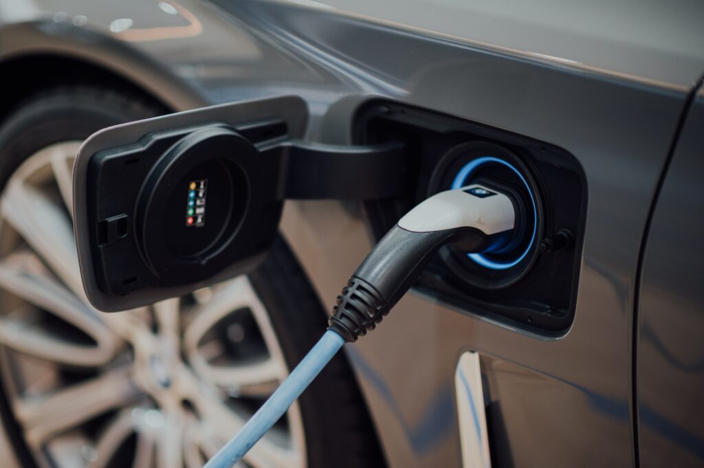 A close up view of an electric charging port in an electric vehicle, representing the automotive industry in Windsor