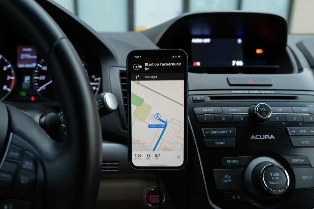 GPS or maps app on an smartphone on a car dashboard, representing employee electronic monitoring
