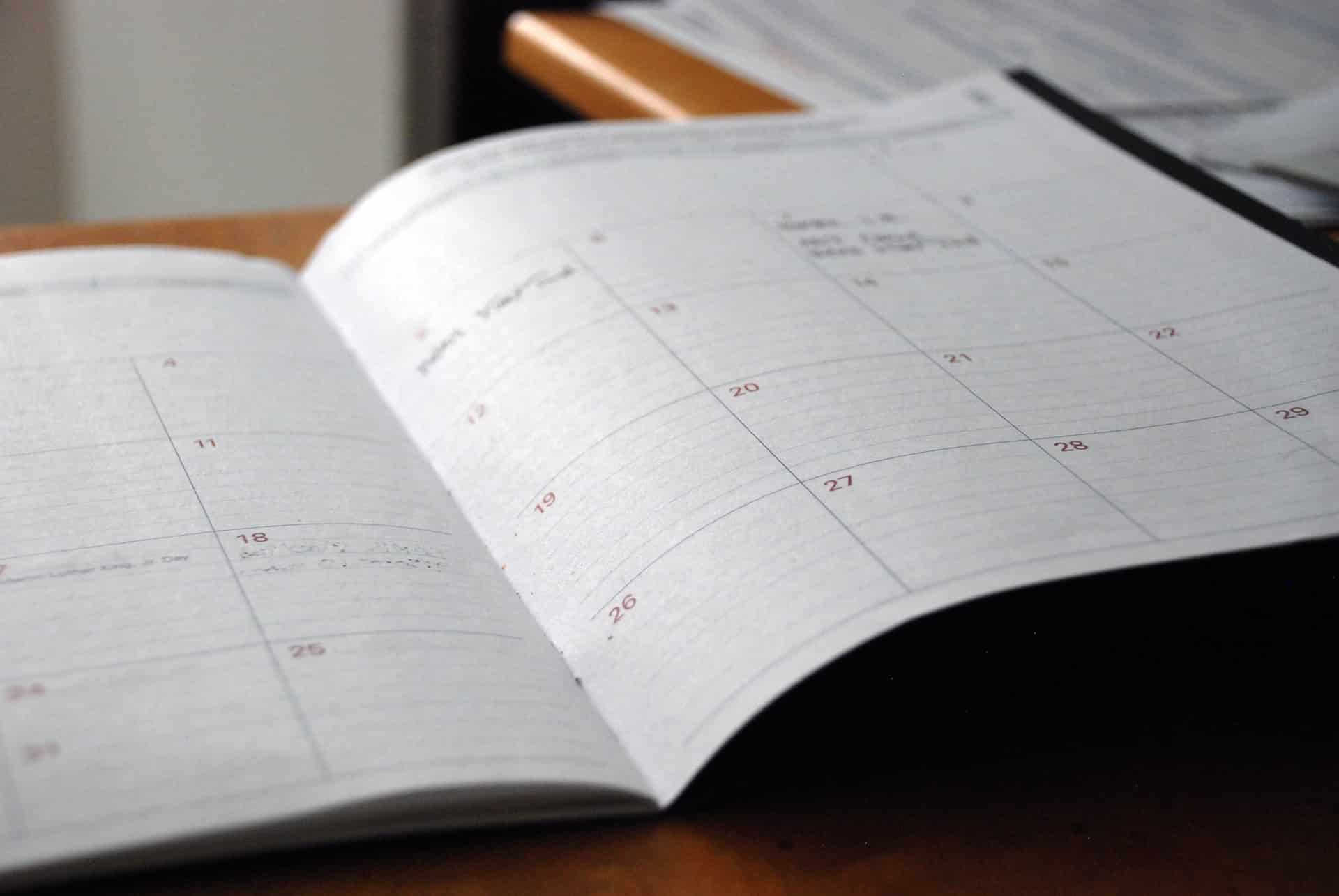 A dayplanner open on a desk, representing scheduling mandatory mediations in Ontario