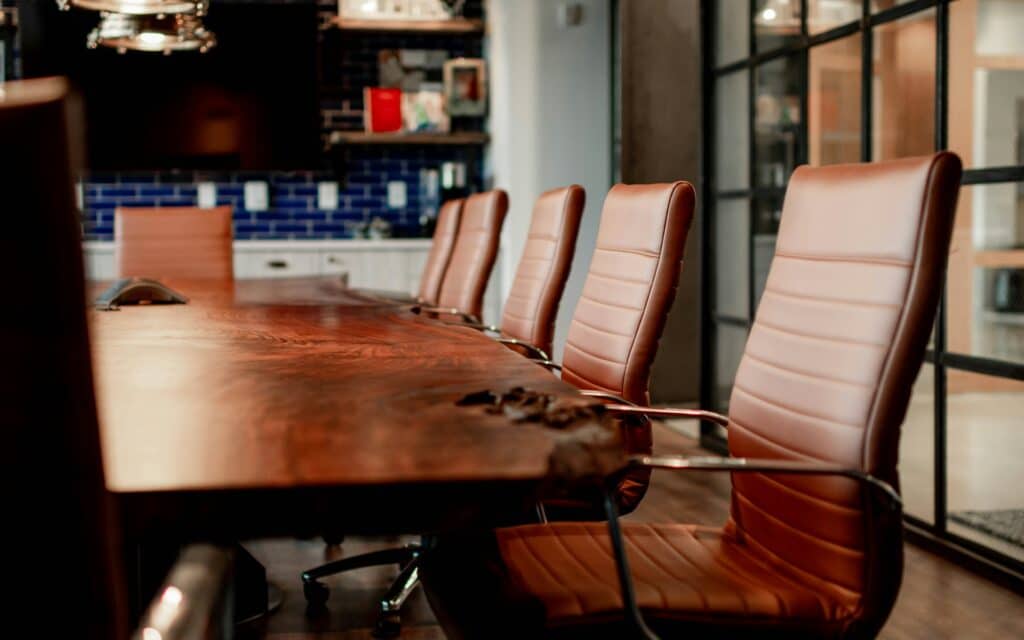 An office meeting table and chairs, representing non-profit conflicts of interest.